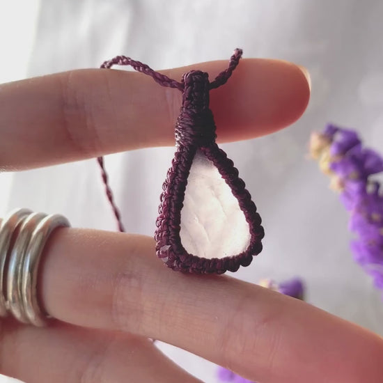 Video of a handmade rose quartz macrame necklace, highlighting the soft pink gemstone’s natural beauty and the delicate macrame craftsmanship.