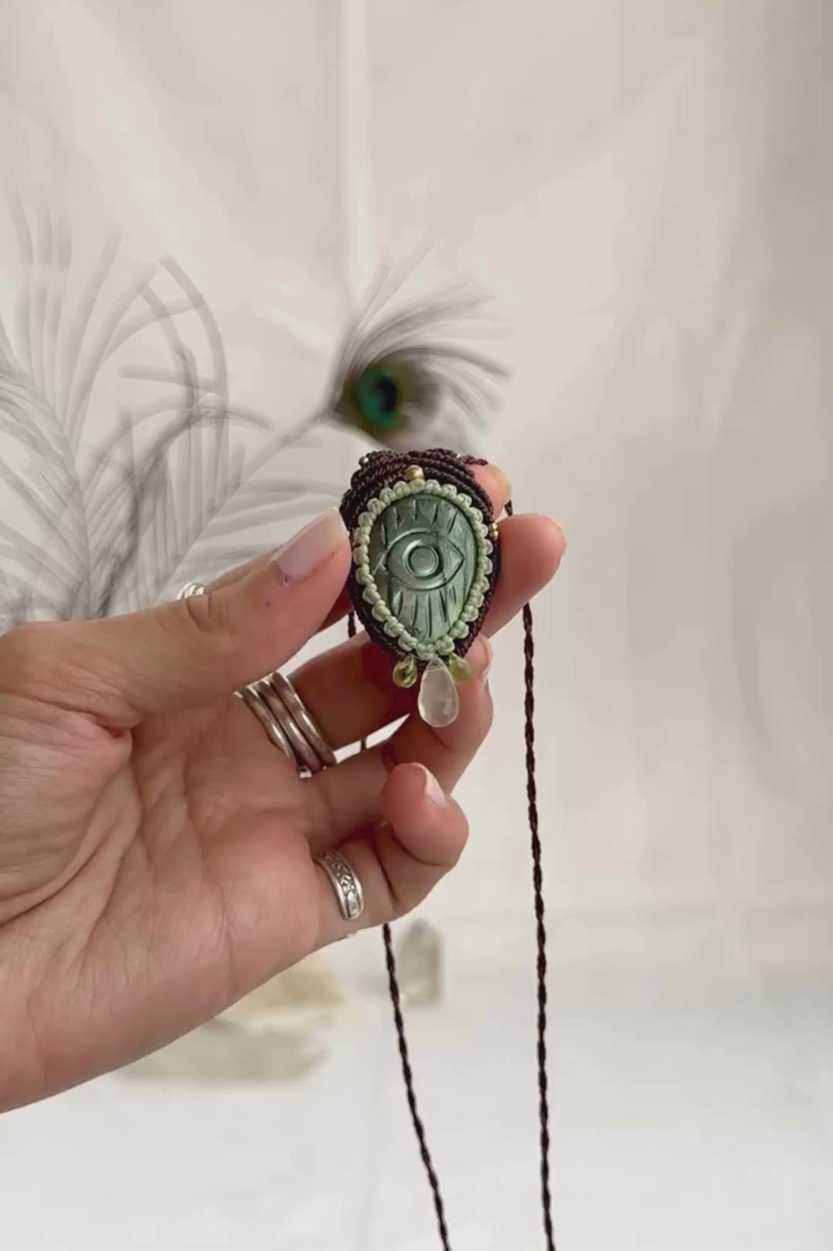 Video of Labradorite protective eye necklace, showing shifting green hues and natural labradorescence of the gemstone, accented with Epidote and Prehnite drops.