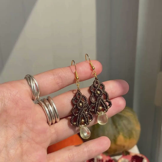 Close-up video of handmade Lemon Quartz earrings, showing their lightweight movement and the sparkling effect of the natural gemstones. The stainless steel hooks add a modern and durable touch.