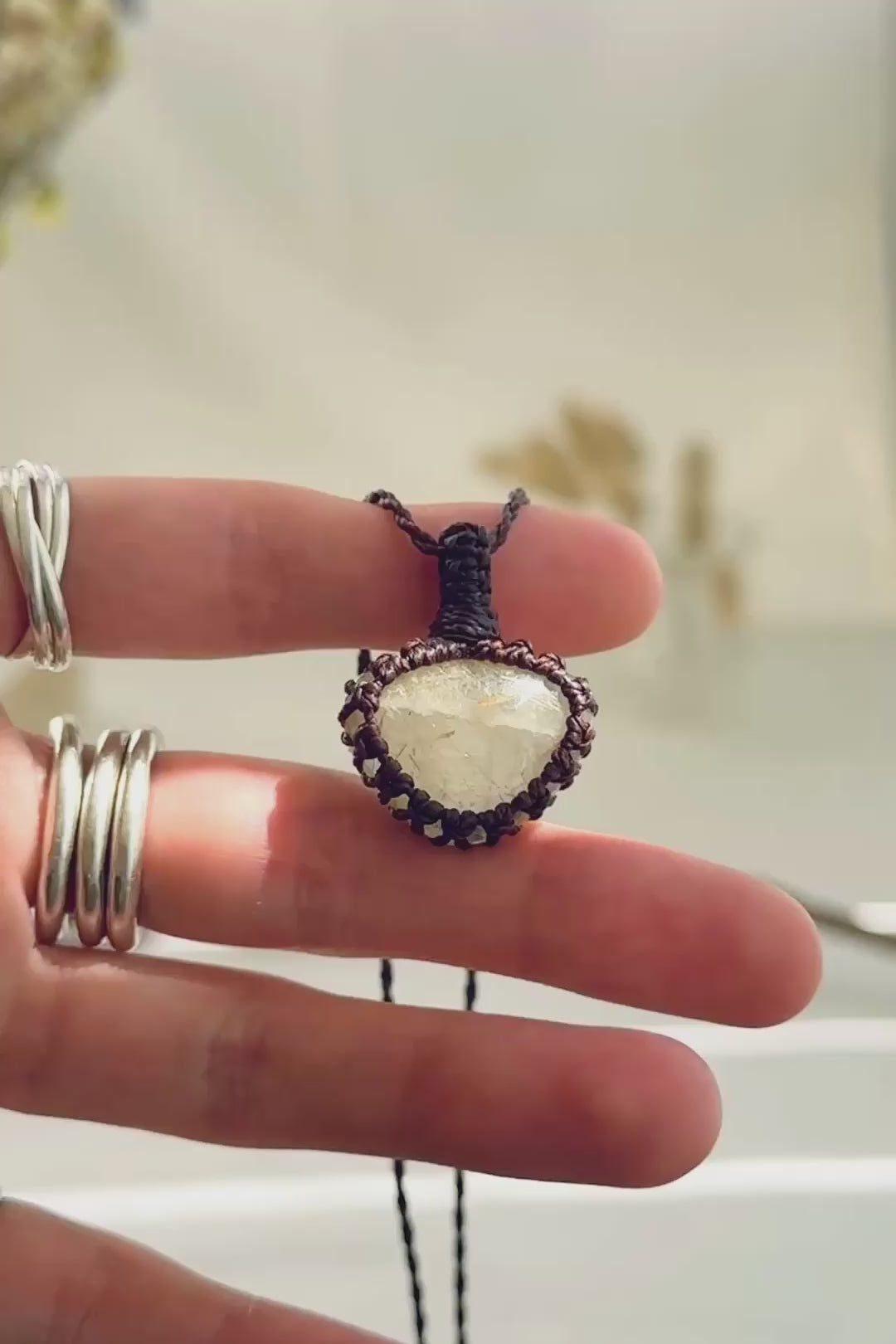 Handmade Rutilated Quartz macramé necklace showing natural gemstone details, texture and shine