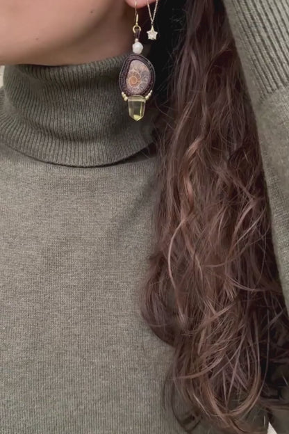 Sliced ammonite earrings in motion, showing dangling smoky quartz and freshwater pearls, highlighting fluidity and lightness