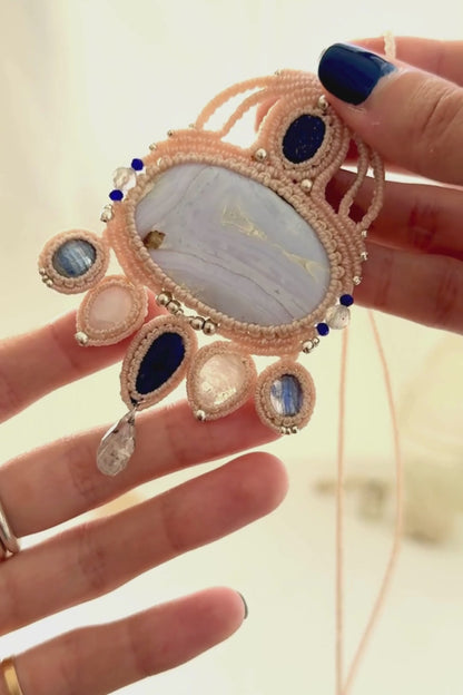 Video showing a one of a kind gemstone macrame statement necklace with flowing movement and natural gemstone shine