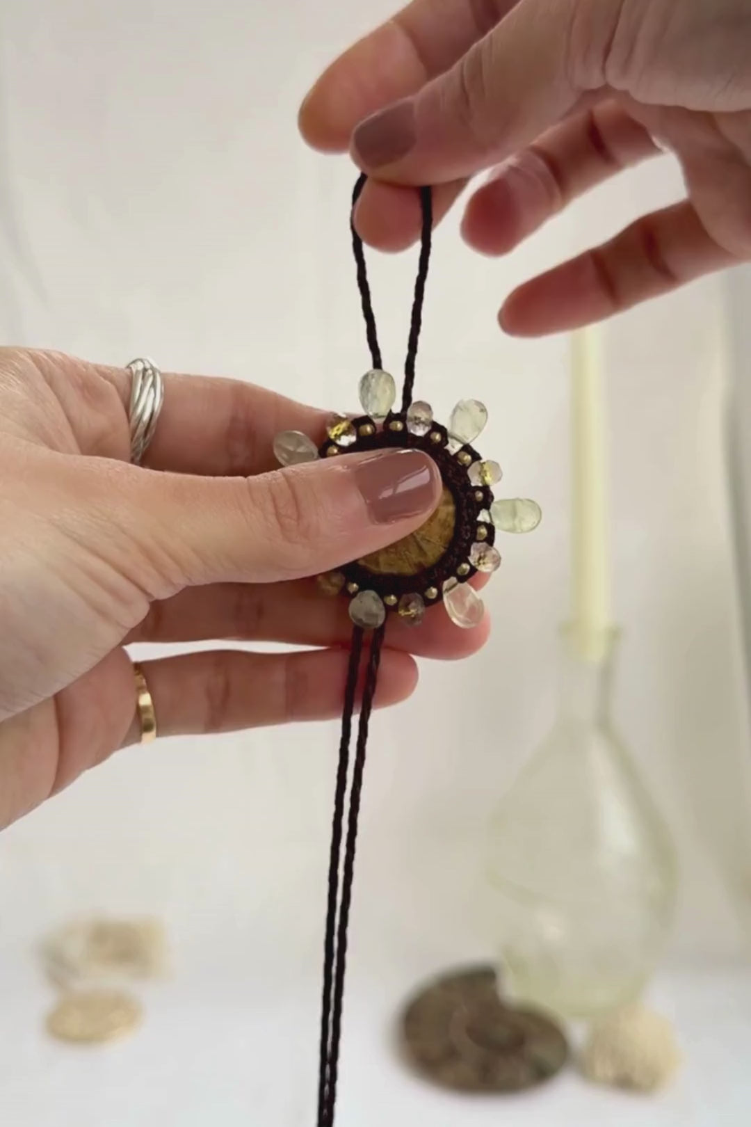 Adjustable sea urchin fossil bolo tie necklace showcasing sliding closure and gemstone details