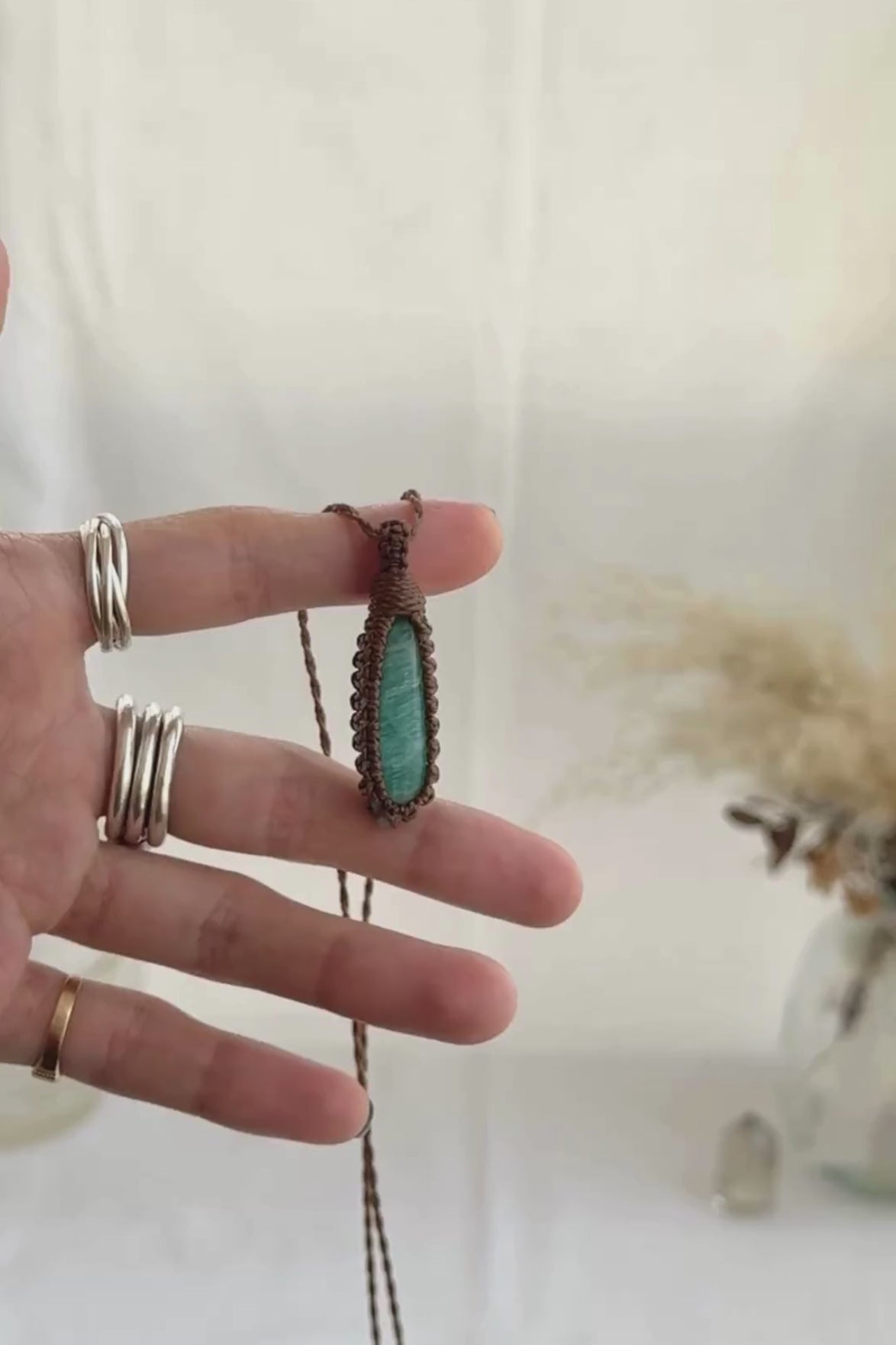 Video of the handmade Amazonite Macrame necklace, highlighting the vibrant tones of the gemstone and the lightweight, minimalist macrame design.