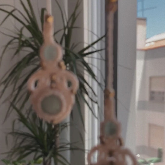 Video showcasing handmade macrame earrings with amazonite and aquamarine gemstones, demonstrating their lightweight feel, elegant movement, and how they shine in light when worn.