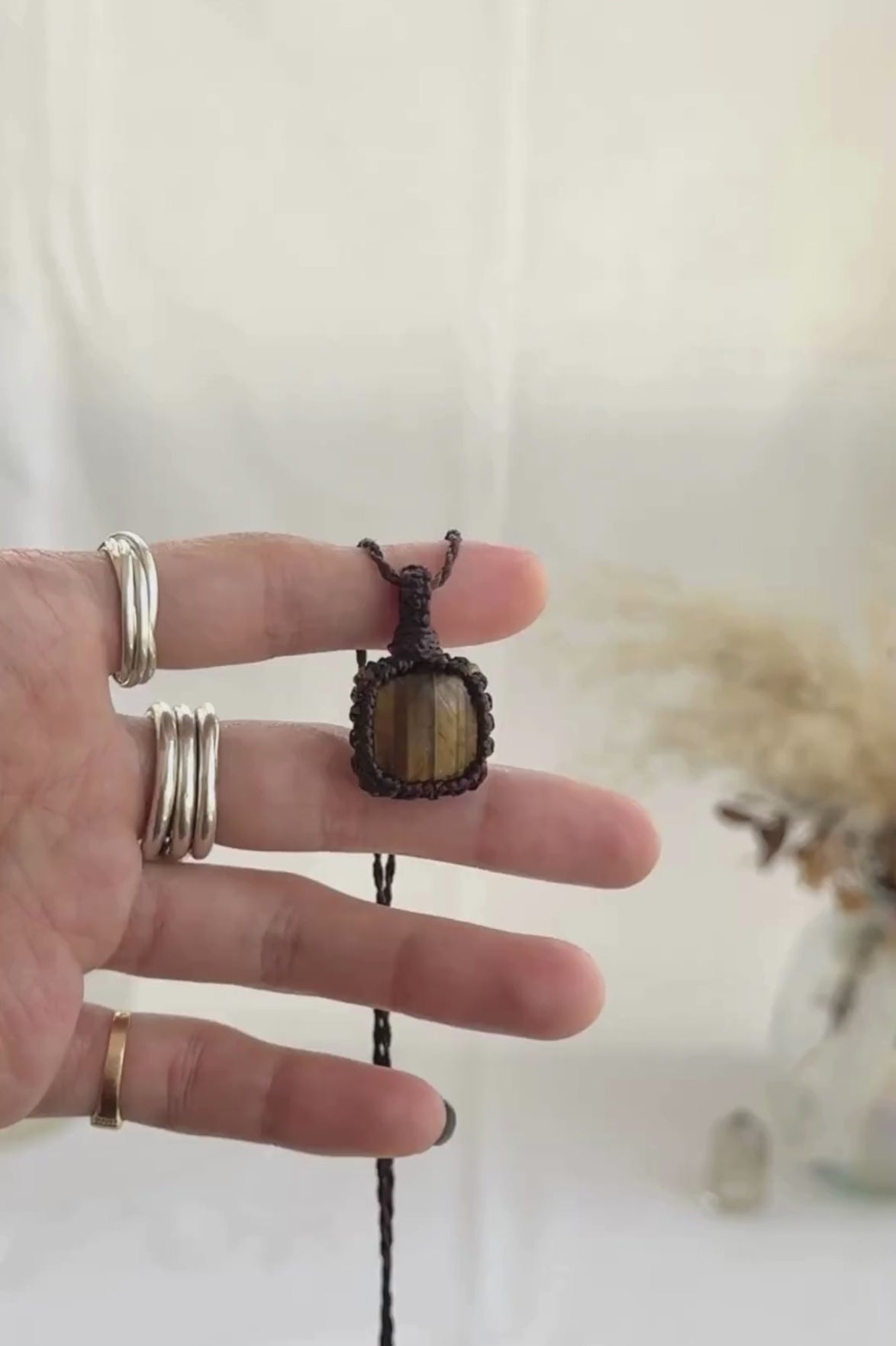 Video of the handmade Tiger’s Eye Macrame necklace, highlighting the vibrant tones of the gemstone and the lightweight, minimalist macrame design.