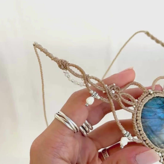Video showing Labradorite macramé necklace with vivid blue flash, freshwater pearls, silver details, and handcrafted design.