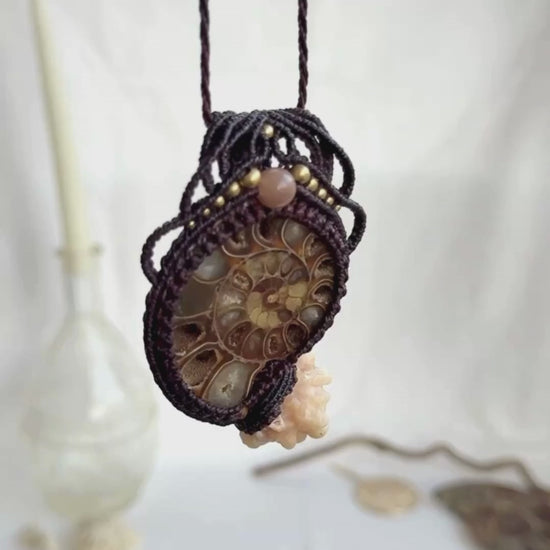 Video showing ammonite fossil necklace with calcite coraloid tentacles, and peach moonstone, highlighting macramé details and fossil texture
