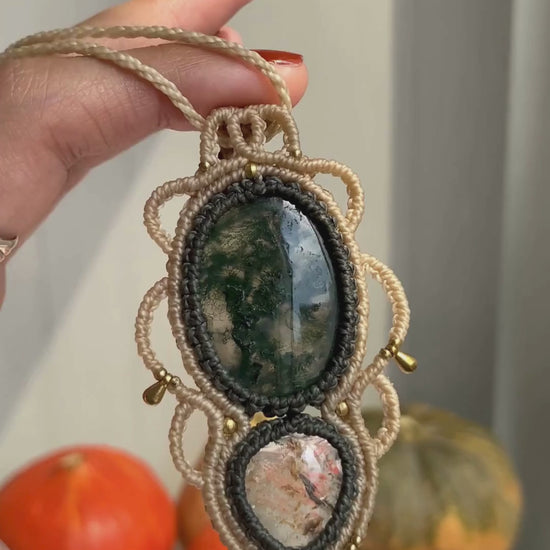 Close-up video of a handmade gemstone necklace, capturing the natural shine and intricate details of Moss Agate and Lodolite. The unique design and polished gemstones reflect the light beautifully, highlighting the craftsmanship and one-of-a-kind artistry.