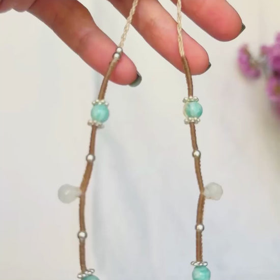 Video showing the Rainbow Moonstone's changing shimmer and the macrame details of the Moonstone and Amazonite necklace.