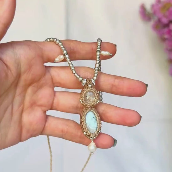 Moonstone and Larimar necklace in motion, showing the Moonstone’s shimmer, gemstone details and the fluid movement of the pendant and pearls.