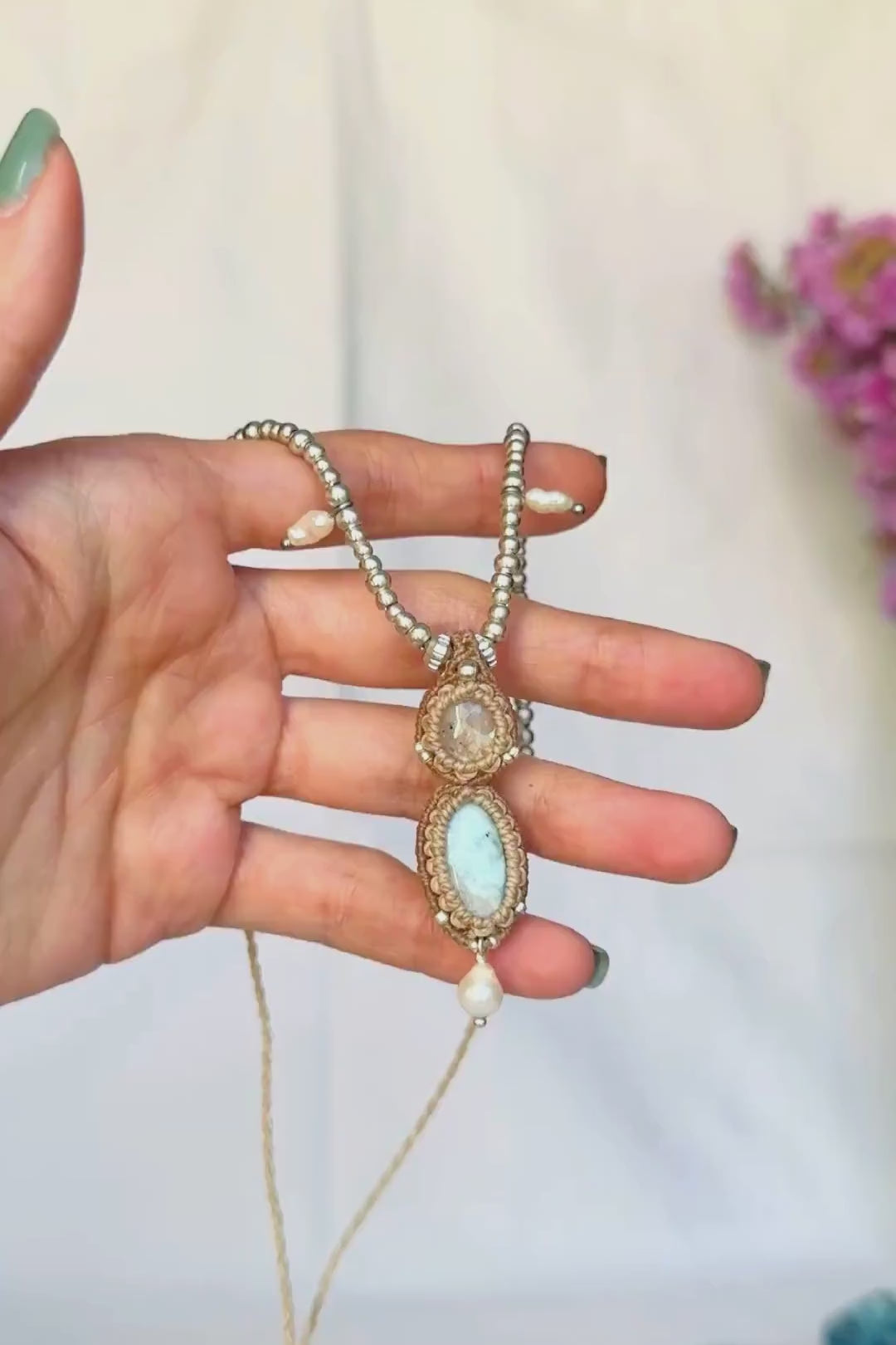 Moonstone and Larimar necklace in motion, showing the Moonstone’s shimmer, gemstone details and the fluid movement of the pendant and pearls.