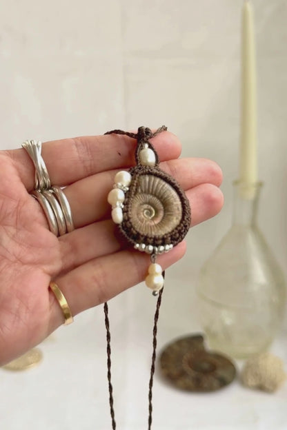 Raw ammonite fossil necklace showcasing natural pearl details and artisan craftsmanship