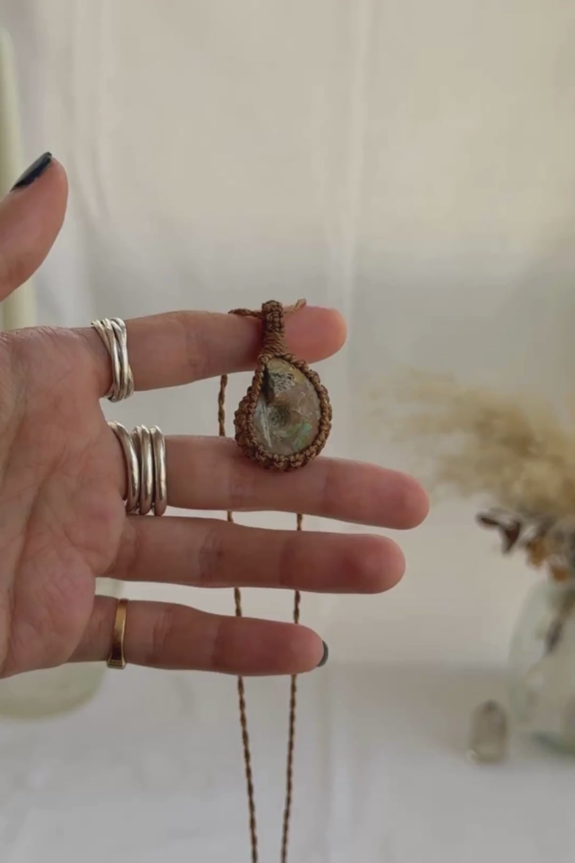 Video of the handmade Ammonite Macrame necklace, highlighting the vibrant tones of the gemstone and the lightweight, minimalist macrame design.