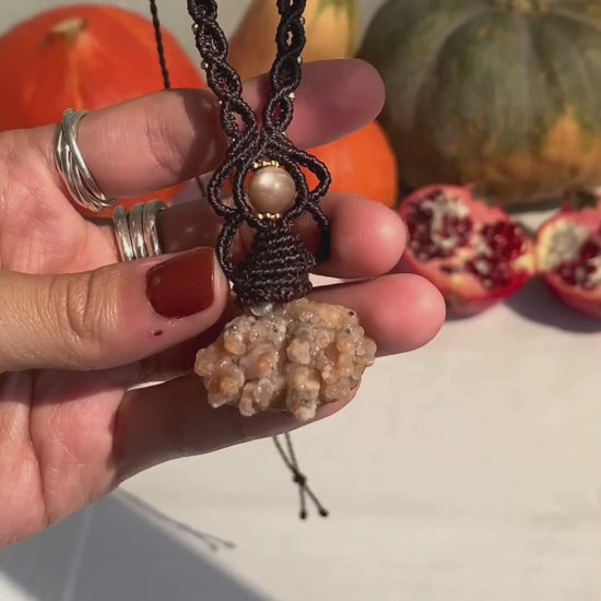 Close-up video of a handmade gemstone necklace, capturing the natural shine and intricate details of Raw Chalcedony and Peach Moonstone. The unique design and polished gemstones reflect the light beautifully, highlighting the craftsmanship and one-of-a-kind artistry.