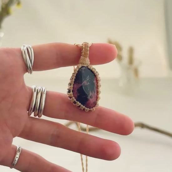 Handmade Rhodonite macramé necklace showing natural gemstone details, texture and shine