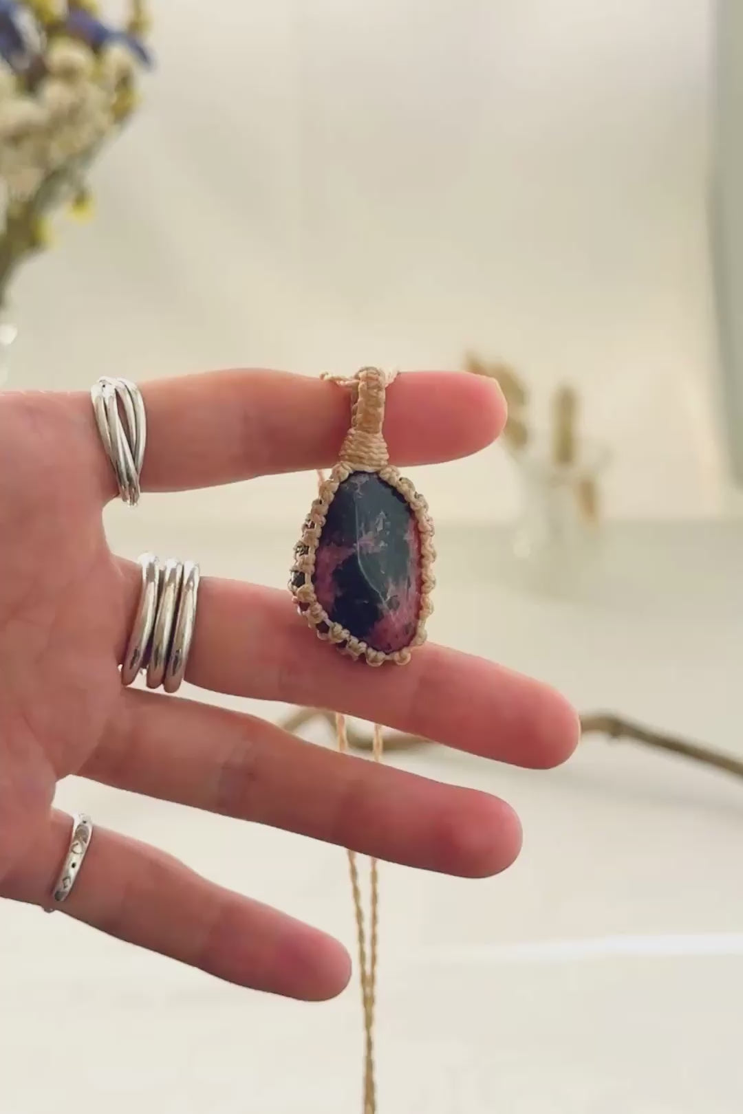 Handmade Rhodonite macramé necklace showing natural gemstone details, texture and shine